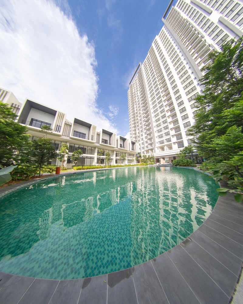 Alstonia pool with the condominium tower behind